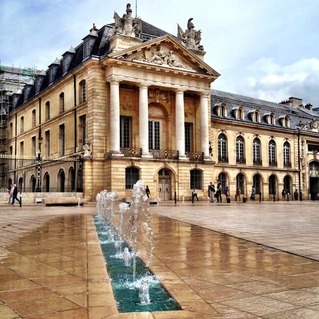 Main square and water features in Dijon, France.