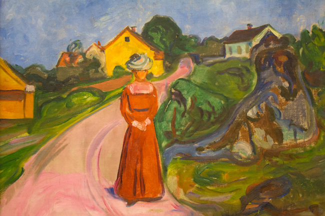 Edvard Munch's 'Woman in Red Dress' shows a women in a red dress and green hat walking down a rural street.