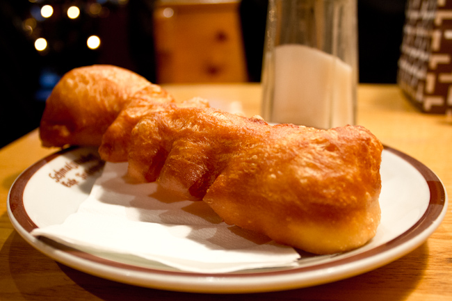 A schmalznudel long doughnut at Cafe Frischhut in Munich before being dipped in sugar. 