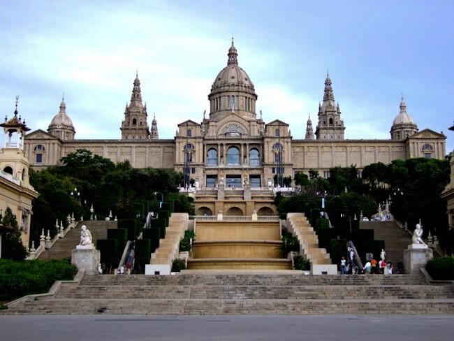 Looking up the steps towards historic building in Barcelona. 