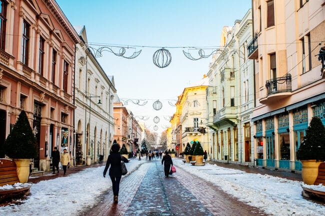 Karasz Utca with snow and Christmas decorations.