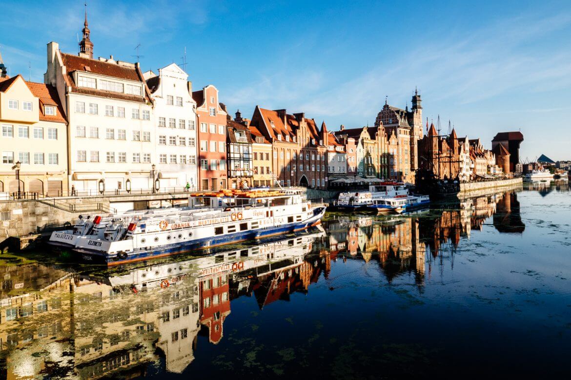 The riverfront area with gable rooftops and the medieval crane in Gdansk.