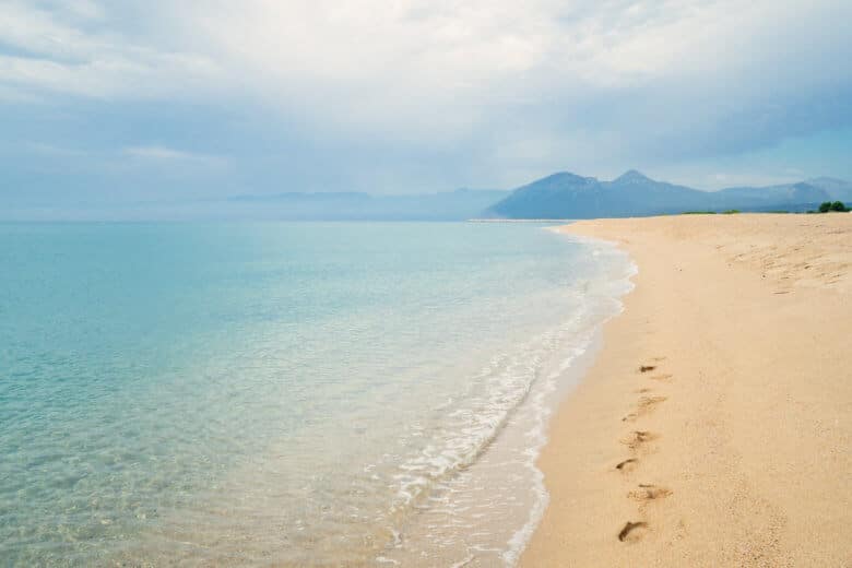 Yellow sand and green water at Orosei Beach, Sardinia