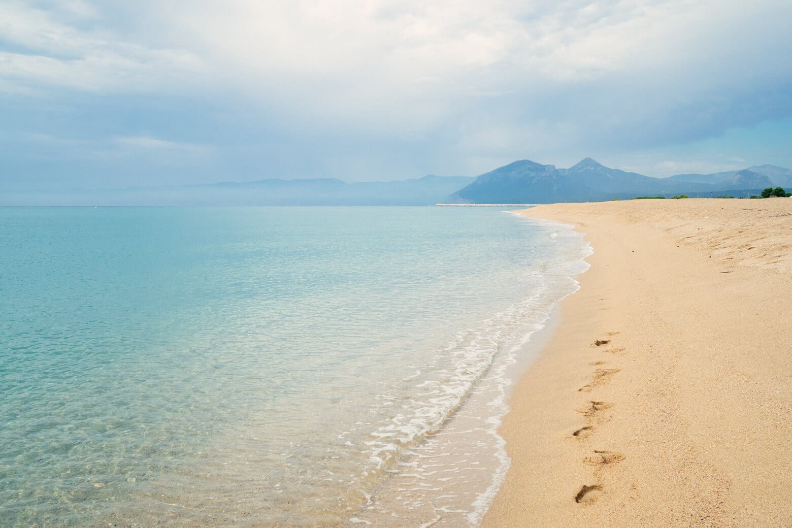 Yellow sand and green water at Orosei Beach, Sardinia