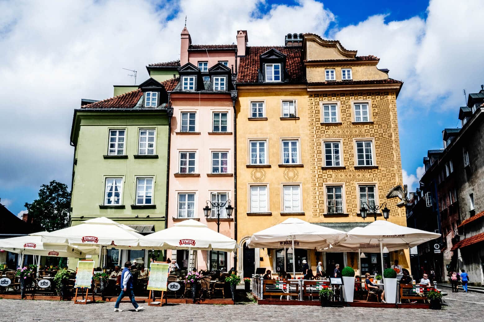 Green, pink and yellow buildings in Old Town Warsaw, Poland