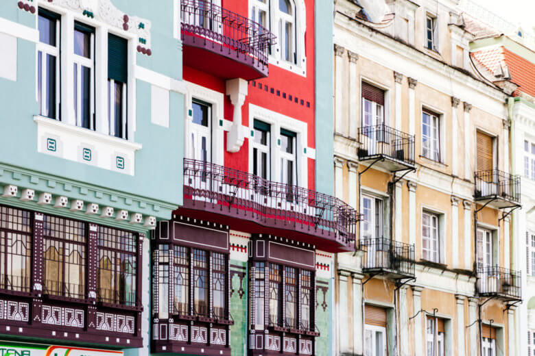 Close up of Art Nouveau green, red and yellow buildings in Timisoara Romania.
