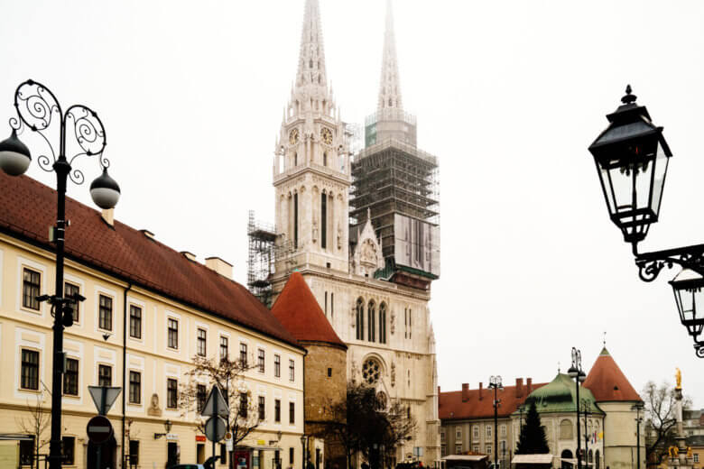 Zagreb Cathedral undergoing renovation on a foggy day in Winter.