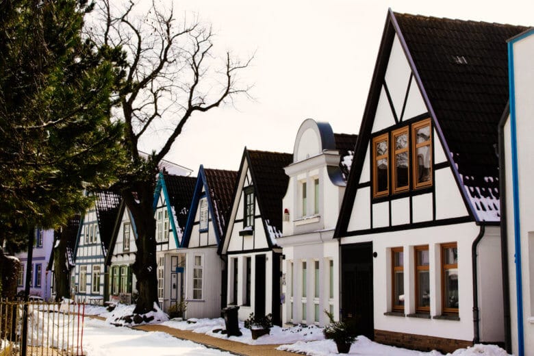 Cute workers cottages covered in snow in Warnemuende at Christmas.